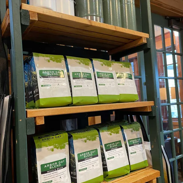 A shelf displaying various bags of coffee, showcasing different flavors.