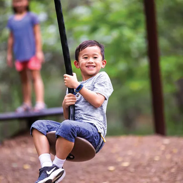 Child riding on zipline