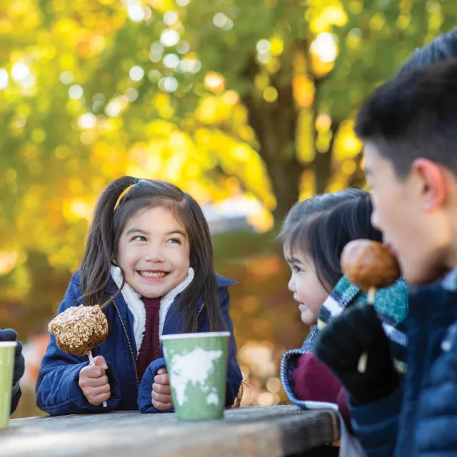 Family eating Caramel Apples