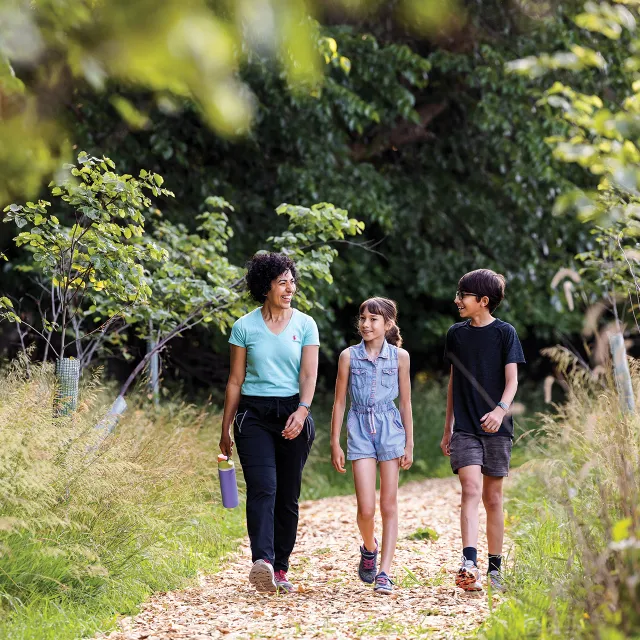 Family walking on trail
