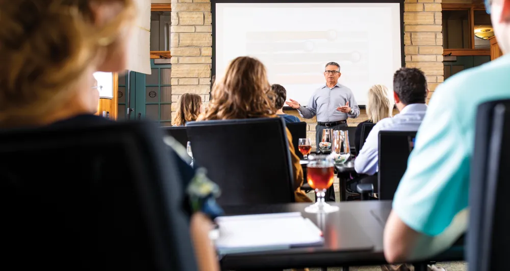 Man leading meeting in Lied Lodge