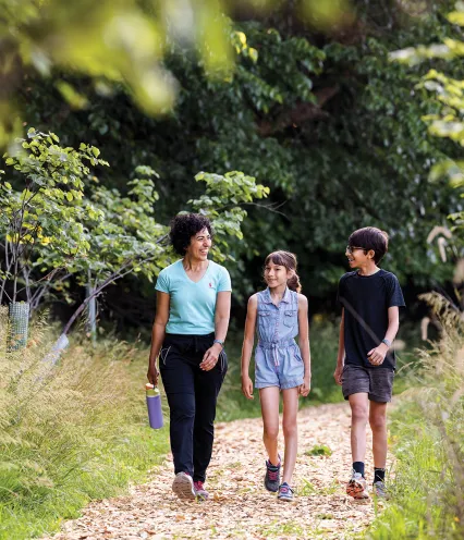 Family walking on trail