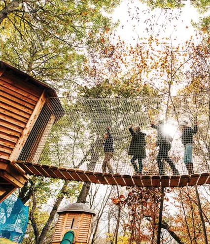 Family walking in tree village