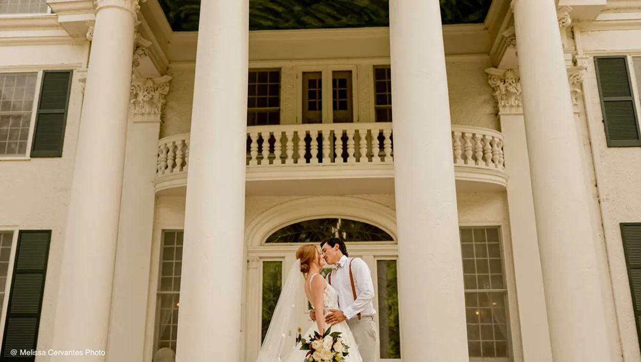 Couple in front of Arbor Lodge
