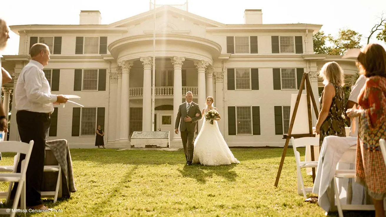 Bride walking into ceremony at Arbor Lodge