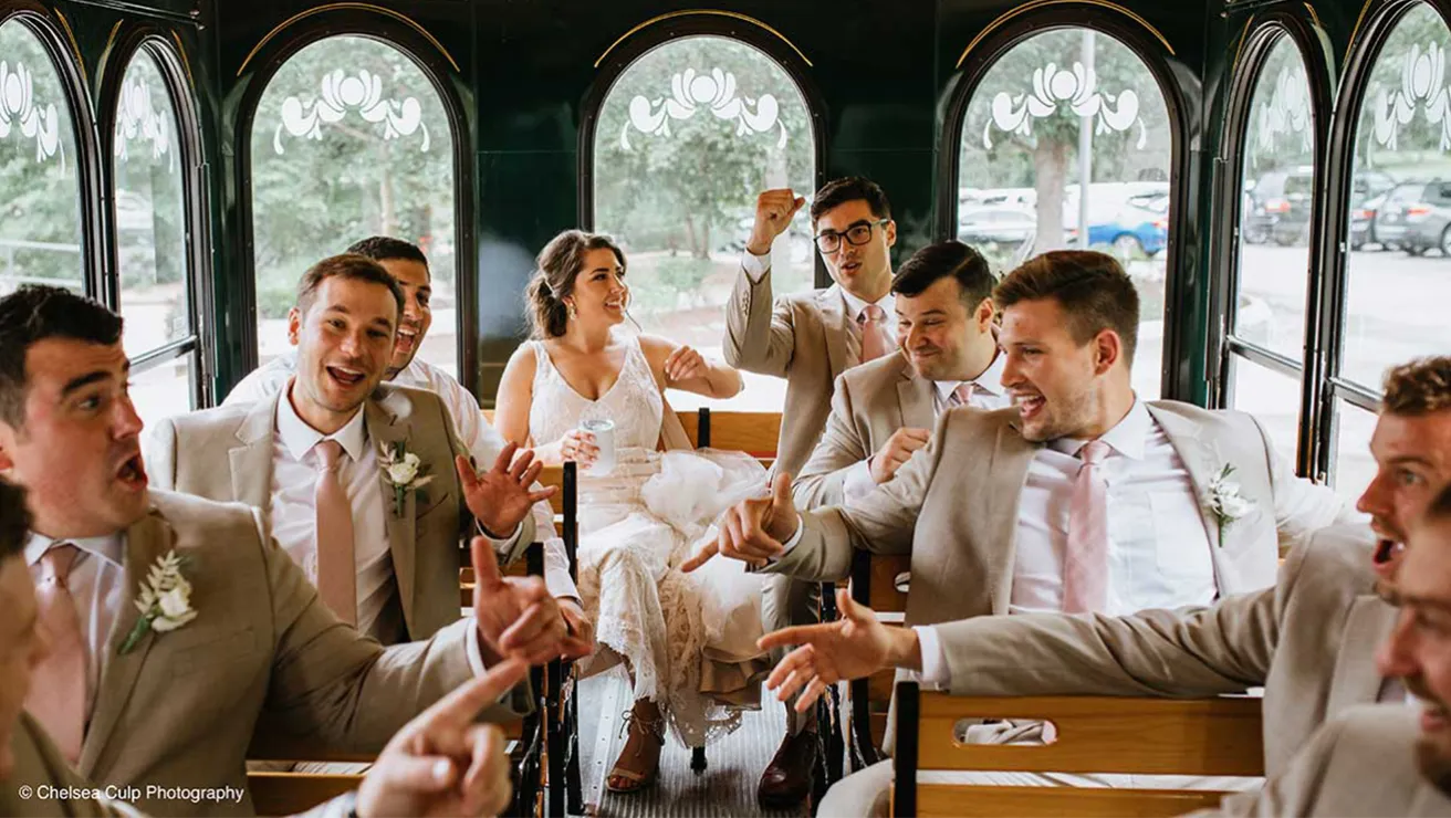 Wedding party in the back of Arbor Day Trolly